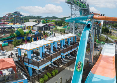 The Edge Watercoaster view of the ride and the cabanas located right next to the wall with riders in tubes for website gallery