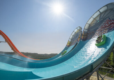 The Edge Watercoaster side view of the wall with riders in tubes going up it for website gallery