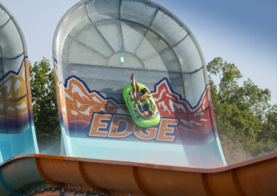 The Edge Watercoaster right view of the wall with riders in tubes going up it for website gallery