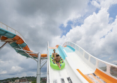 The Edge Watercoaster riders in tubes dropping in one lane for website gallery